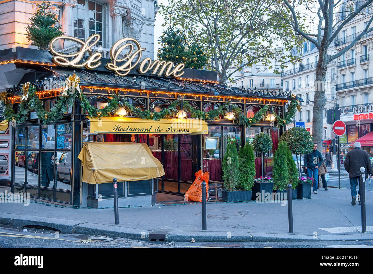 Le Dome Café during late November in Paris. It is a legendary brasserie and restaurant in Montparnasse established 1898 Stock Photo