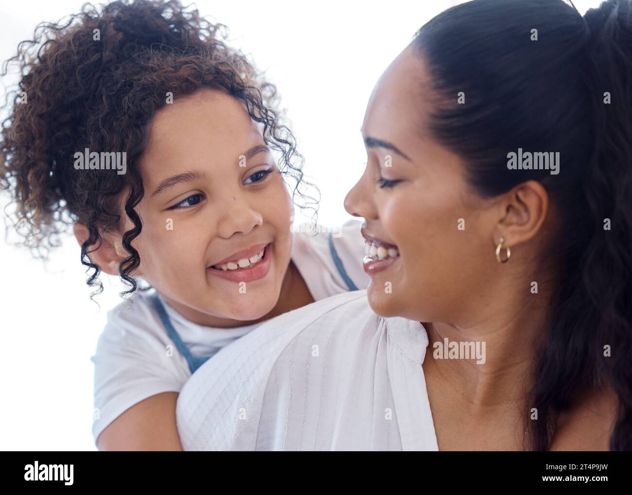 She adores her mom. a little girl bonding with her mother at home Stock