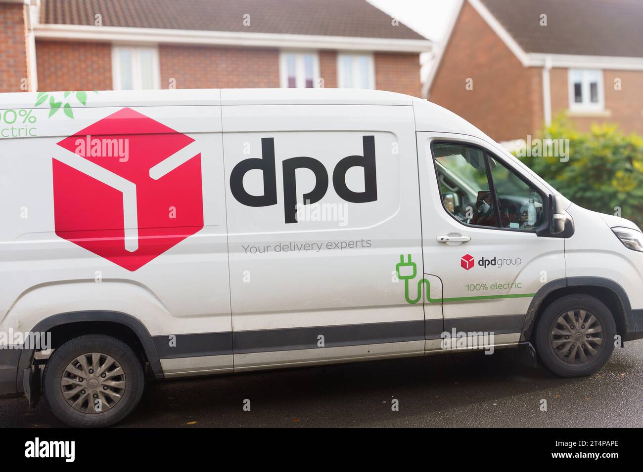 DPD van (an electric vehicle) doing deliveries in a residential area. Stock Photo
