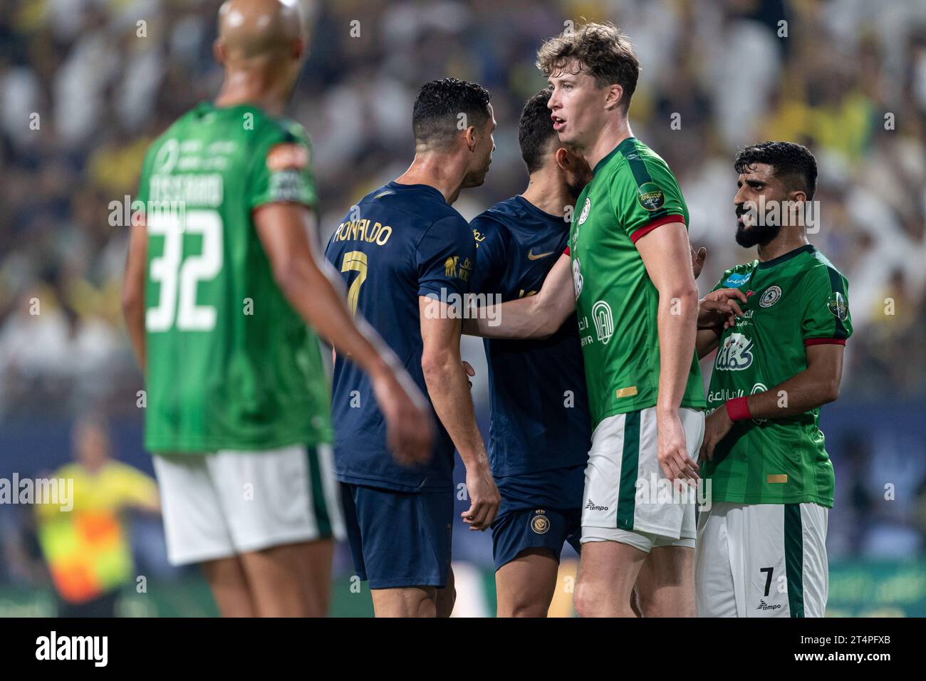 Cristiano Ronaldo of Al Nassr FC argues with Mohammed Al-Kuwaykibi of Al Ettifaq FC during their Round 16 of the SAFF Saudi Arabia KingÕs Cup 2023-24 match between Al Nassr FC and Al Ettifaq FC at Al Awwal Park Stadium on October 31, 2023 in Riyadh, Saudi Arabia. Photo by Victor Fraile / Power Sport Images Stock Photo