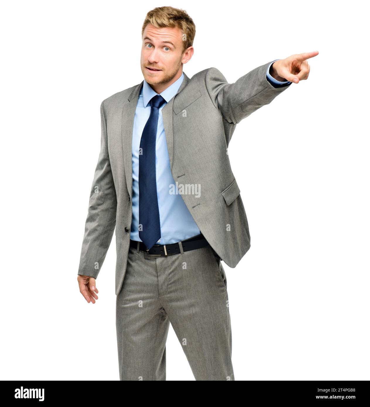 Youre fired. a handsome young businessman standing alone in the studio and pointing in anger. Stock Photo