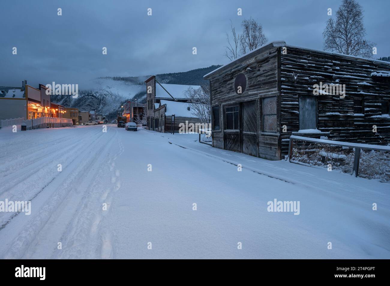 Dawn on a snowy street in Dawson City, Yukon, Canada Stock Photo