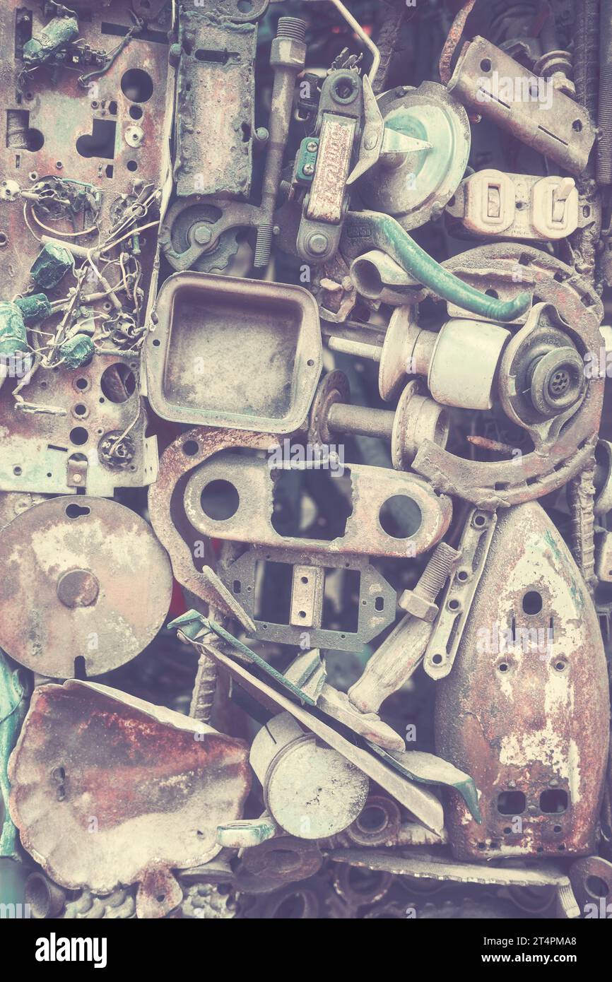 Abstract industrial background made of old machine parts, selective focus, color toning applied. Stock Photo