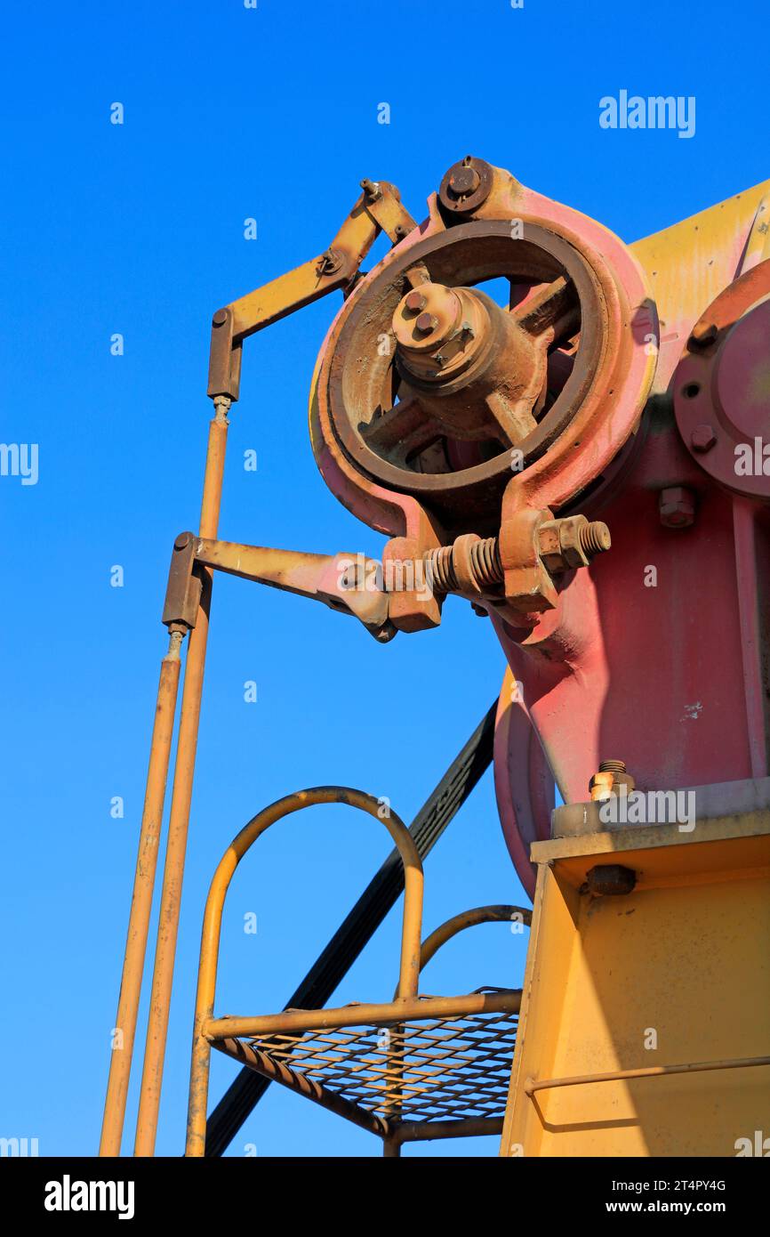 oxidation rust pumping unit parts under blue sky in oilfield Stock