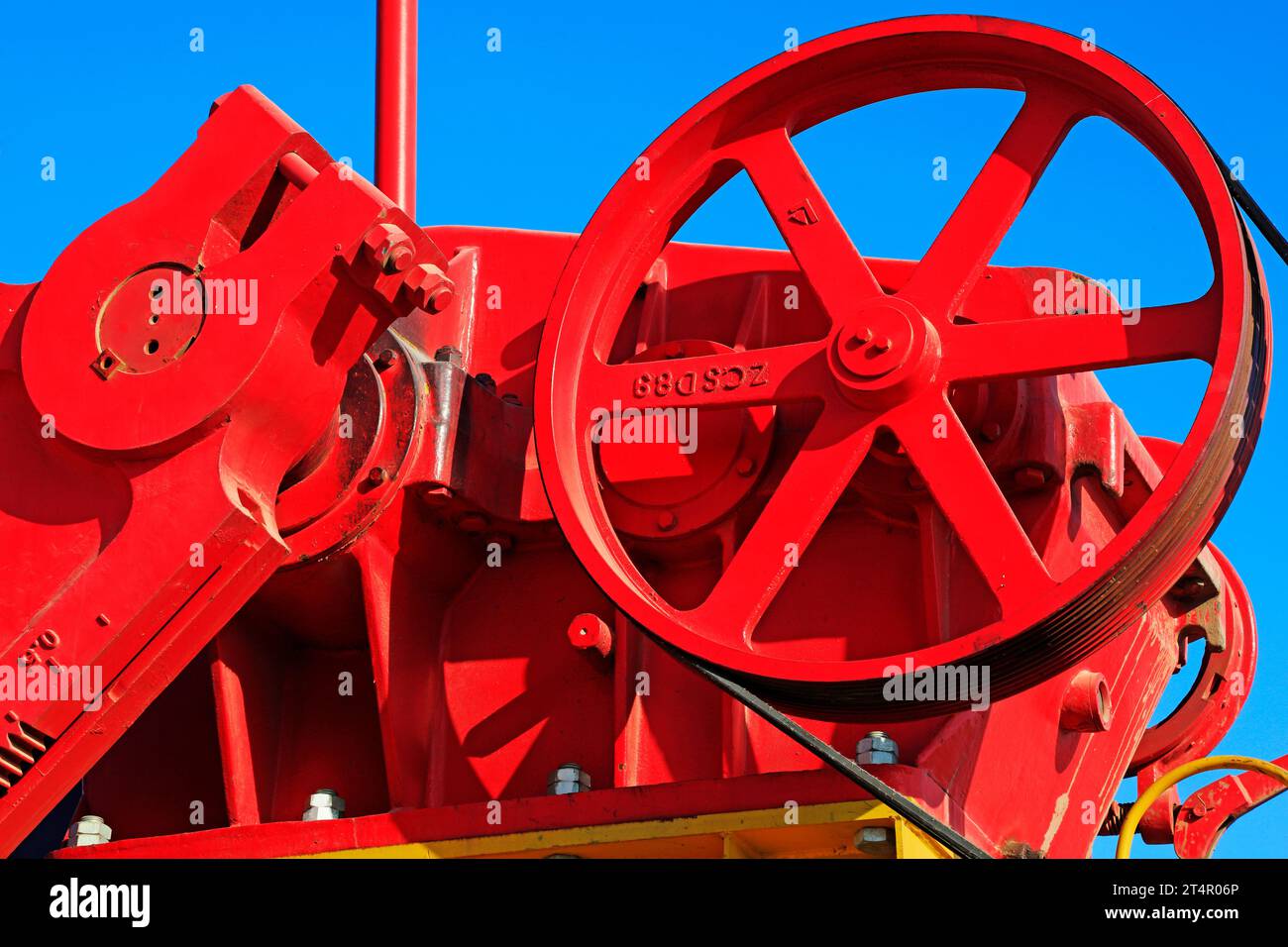 wheels on petroleum machinery under blue sky in oilfield Stock Photo