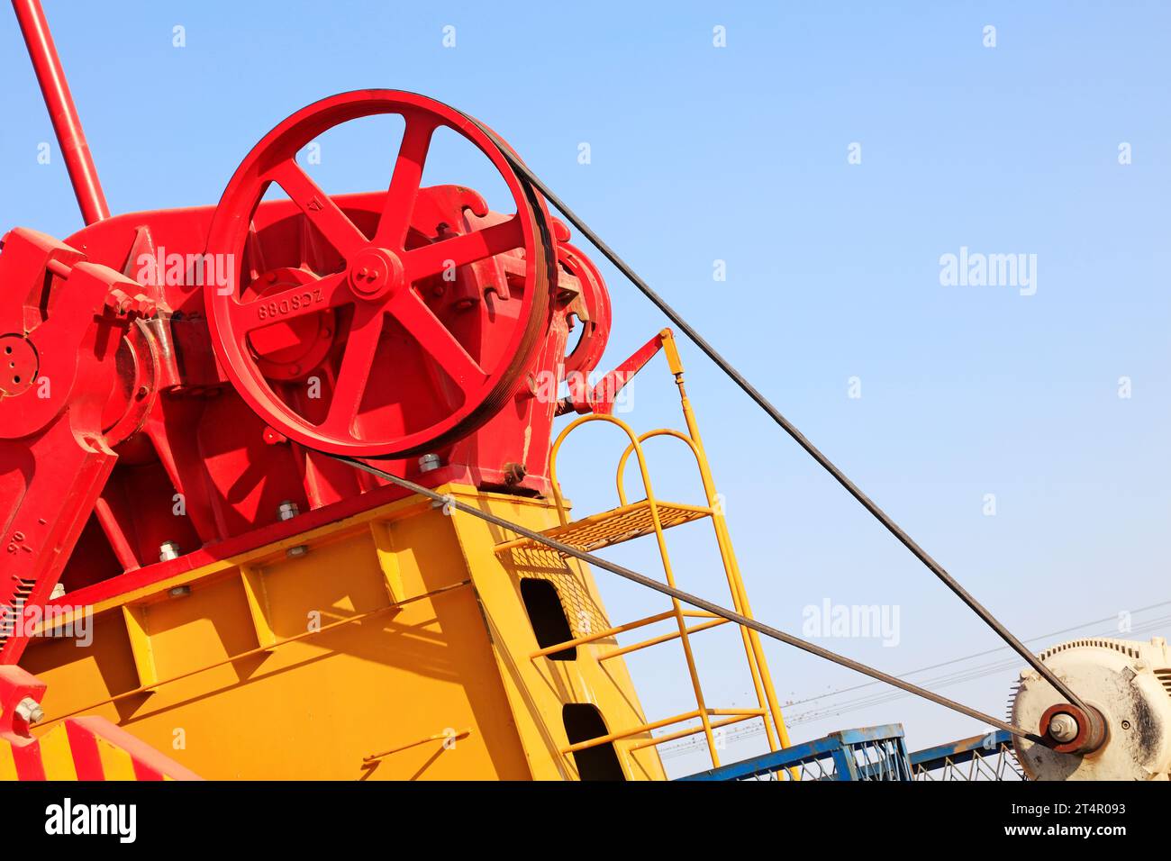 wheels on petroleum machinery under blue sky in oilfield Stock Photo