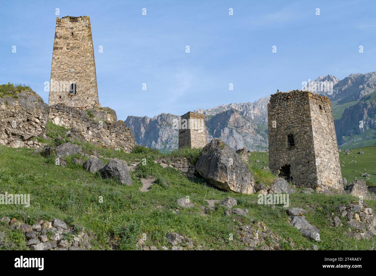 Ancient Ossetian defensive towers in the mountains of North Ossetia on a sunny June day. Tsmiti, North Ossetia-Alania. Russian Federation Stock Photo