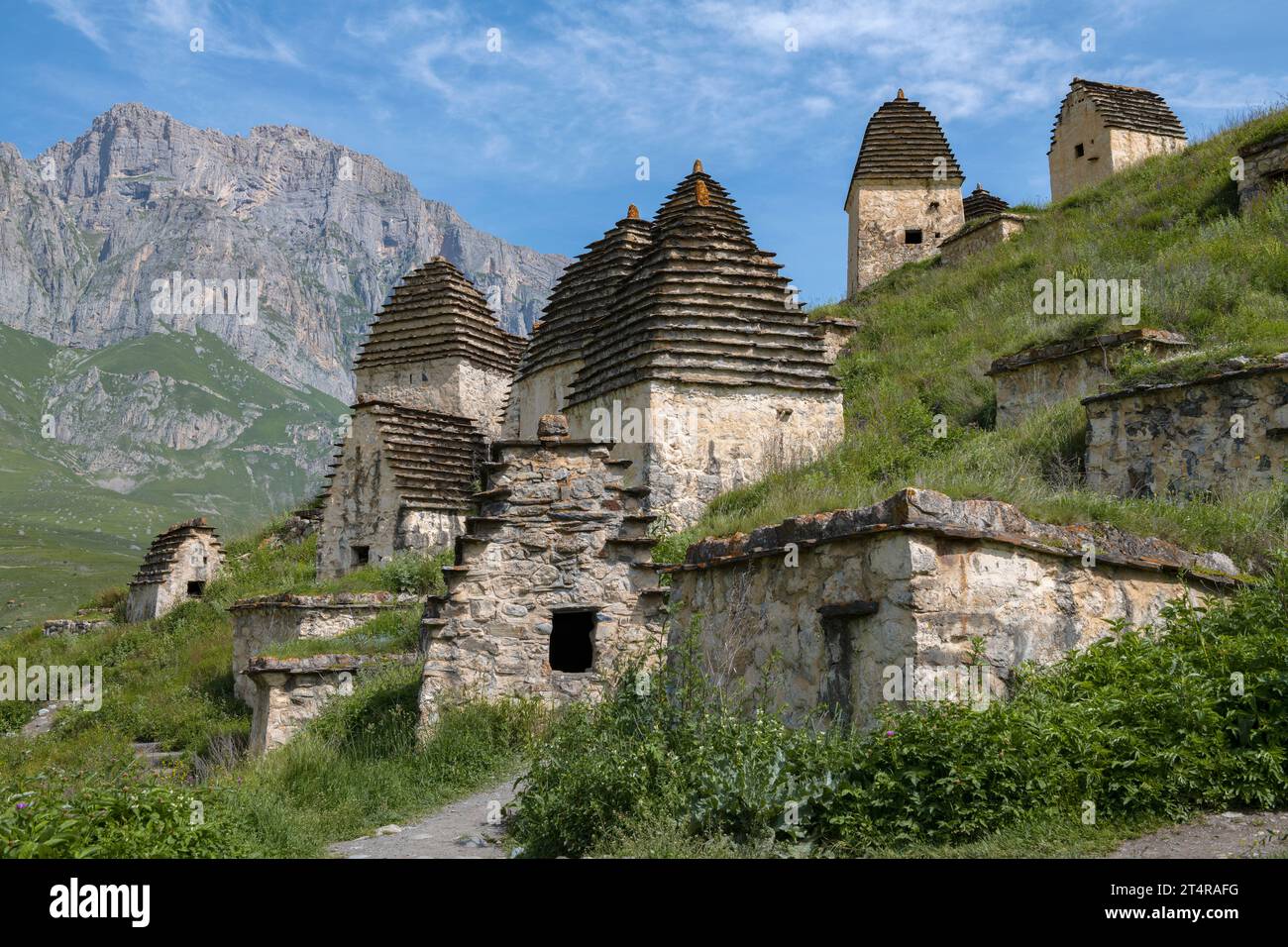 Ancient crypts in the city of the dead Dargavs on a sunny June day. North Ossetia-Alania, Russian Federation Stock Photo