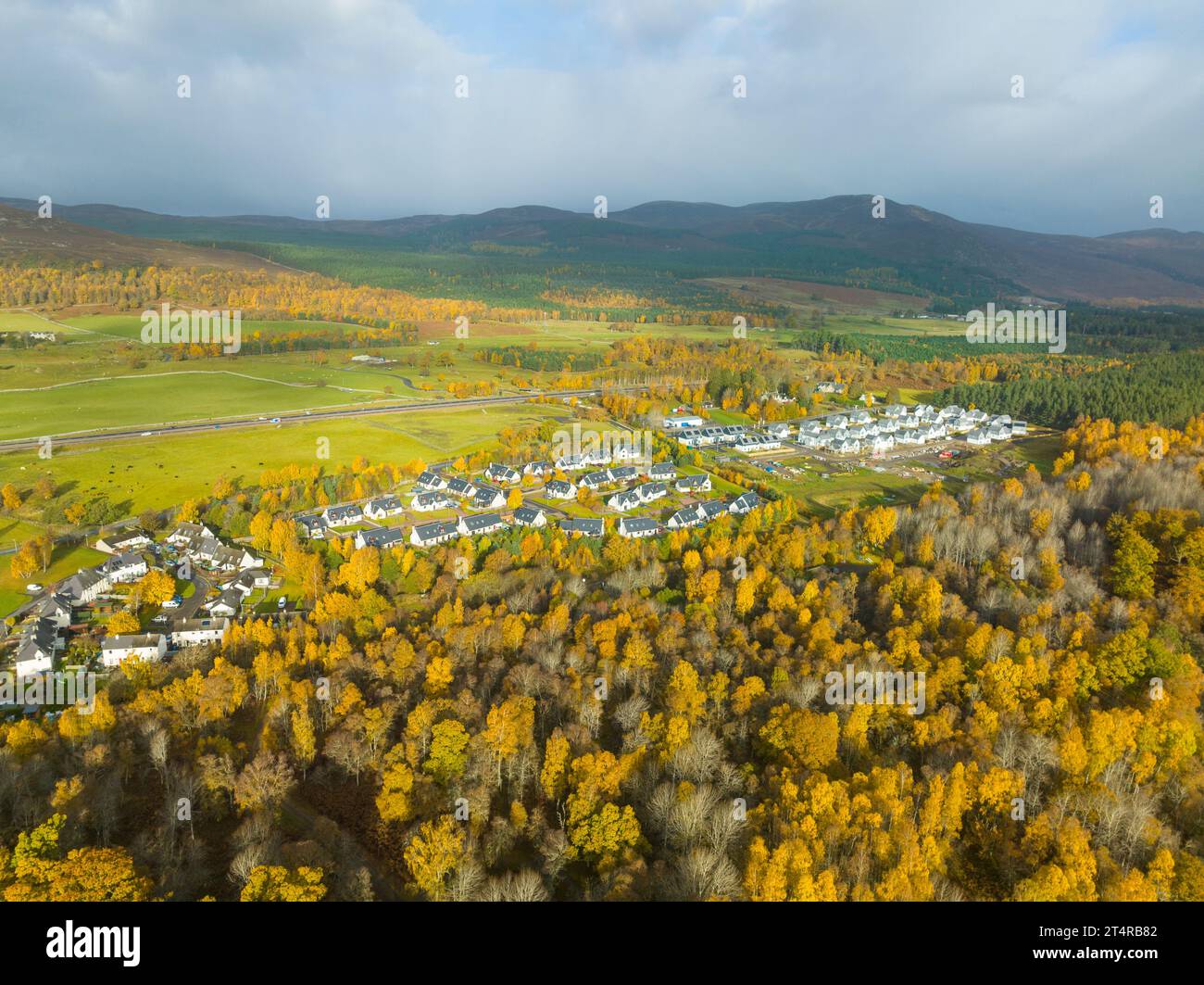 Aerial view of Kincraig village and autumn colours in woodland, Scottish Highlands, Scotland, UK Stock Photo