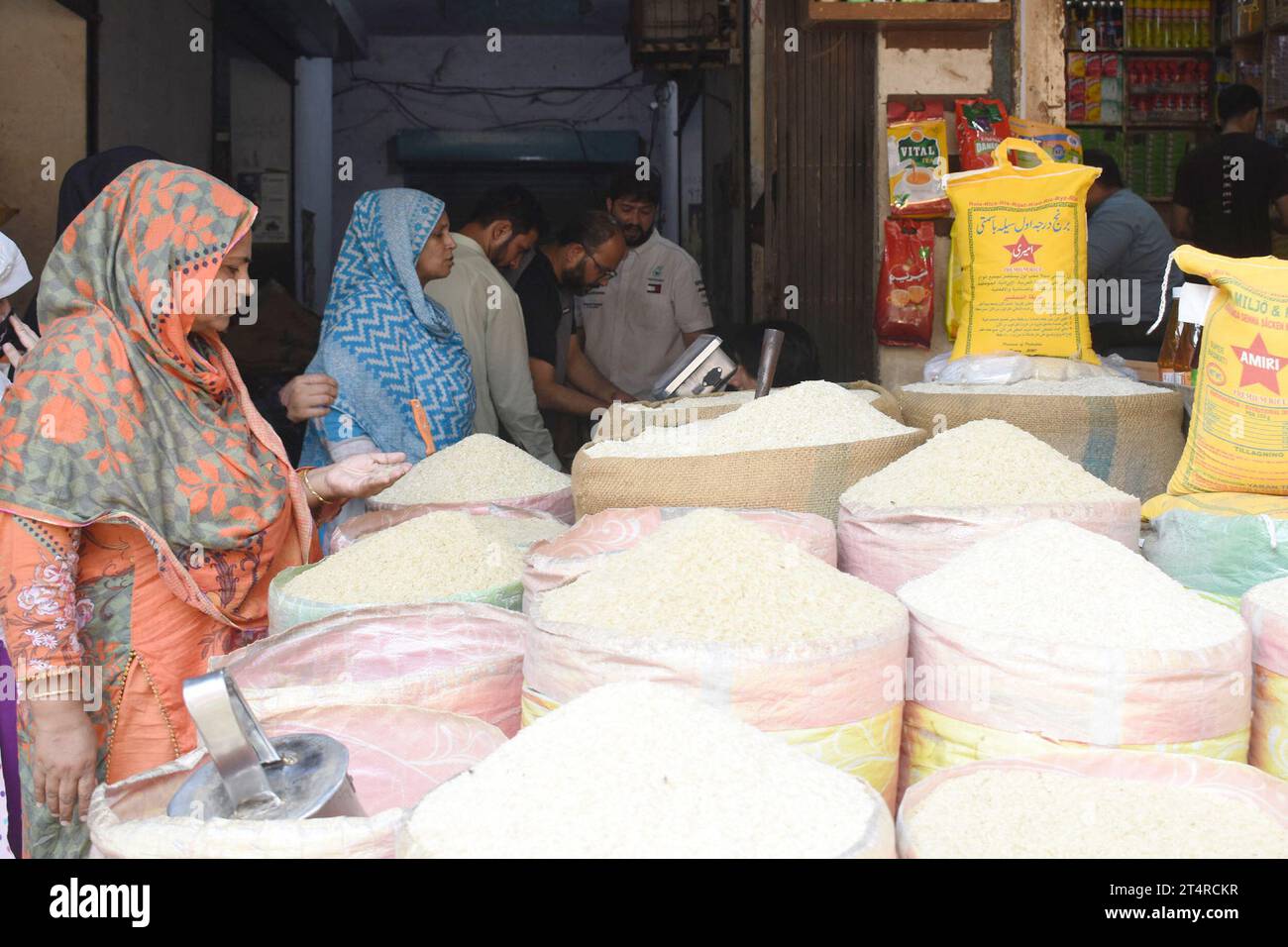 Lahore. 1st Nov, 2023. People buy daily use items from a grocery store at a market in Lahore, Pakistan on Nov. 1, 2023. Pakistan's inflation measured by the Consumer Price Index (CPI) increased by 26.89 percent year-on-year in October 2023, the Pakistan Bureau of Statistics (PBS) said on Wednesday. Credit: Sajjad/Xinhua/Alamy Live News Stock Photo