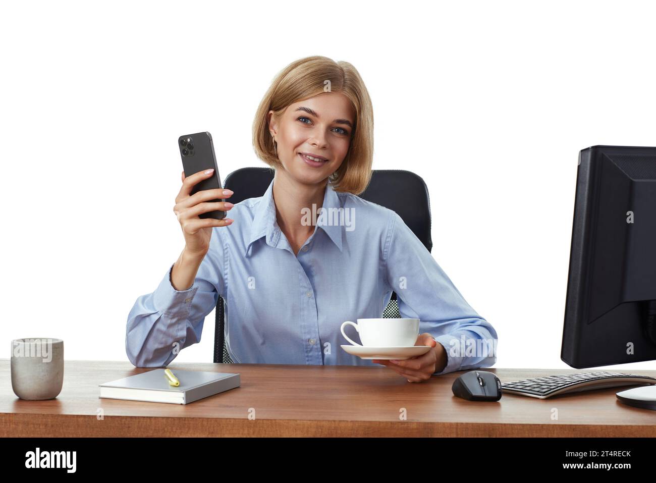 positive blonde business woman using phone, drinking coffee in the office Stock Photo
