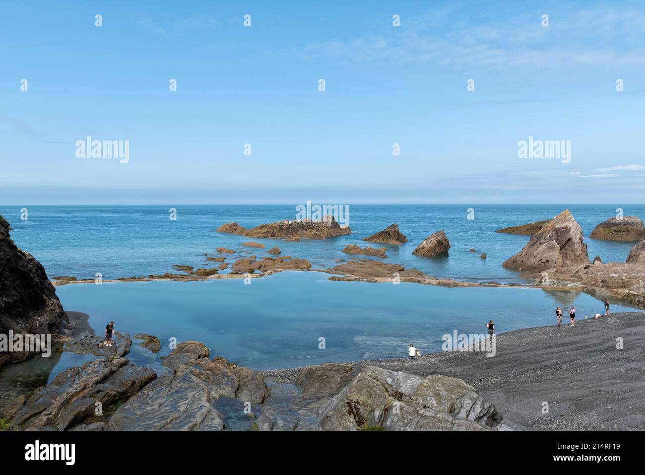 Rock pool on the ladies beach Tunnels Beach in Stock Photo