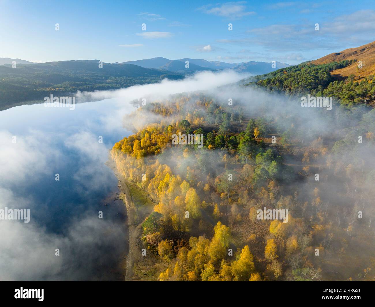 Aerial view of early morning cloud inversion beside Loch Beinn a Mheadhoin in Glen Affric, Scottish Highlands, Scotland,UK Stock Photo