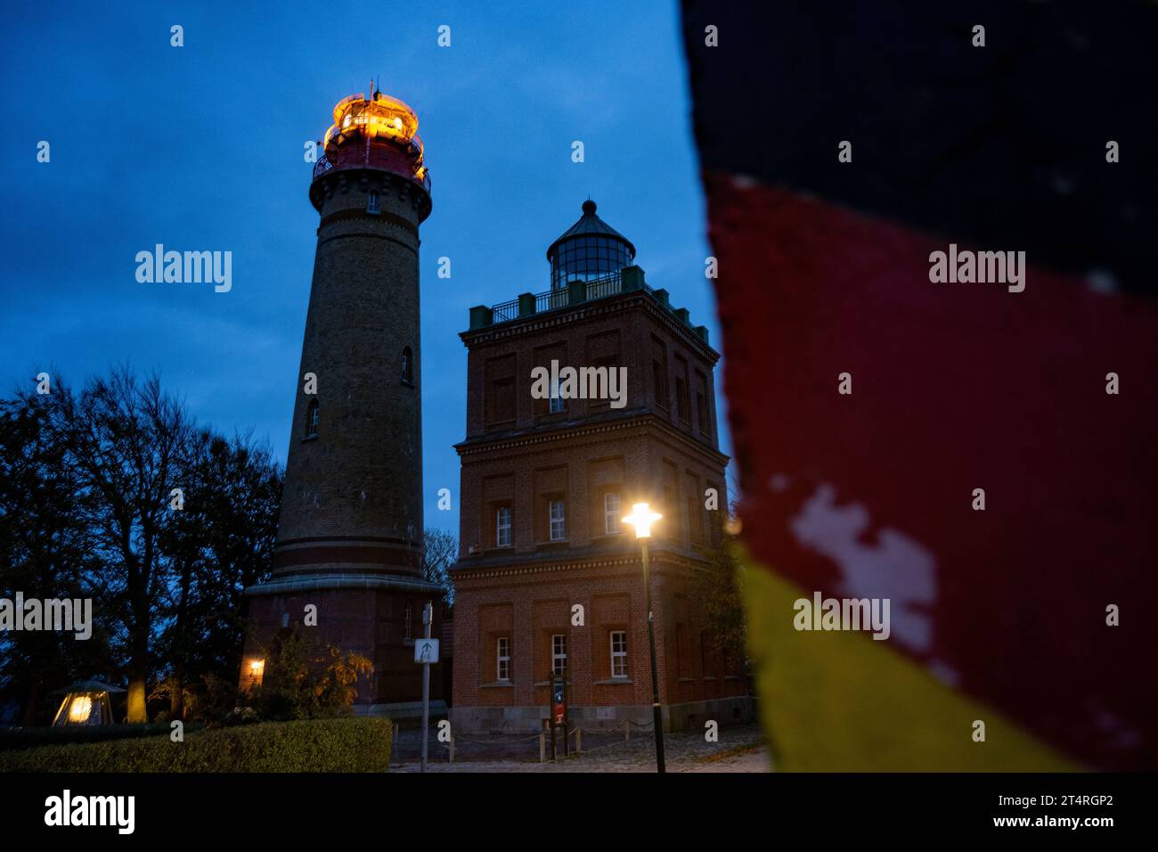 01 November 2023, Mecklenburg-Western Pomerania, Putgarten auf Rügen: The Cape Arkona lighthouse on the island of Rügen sends its light out into the Baltic Sea. After the recent storm surge, the cliff at the northern tip of Rügen, at Cape Arkona, has broken off on a broad front. Photo: -/dpa Stock Photo