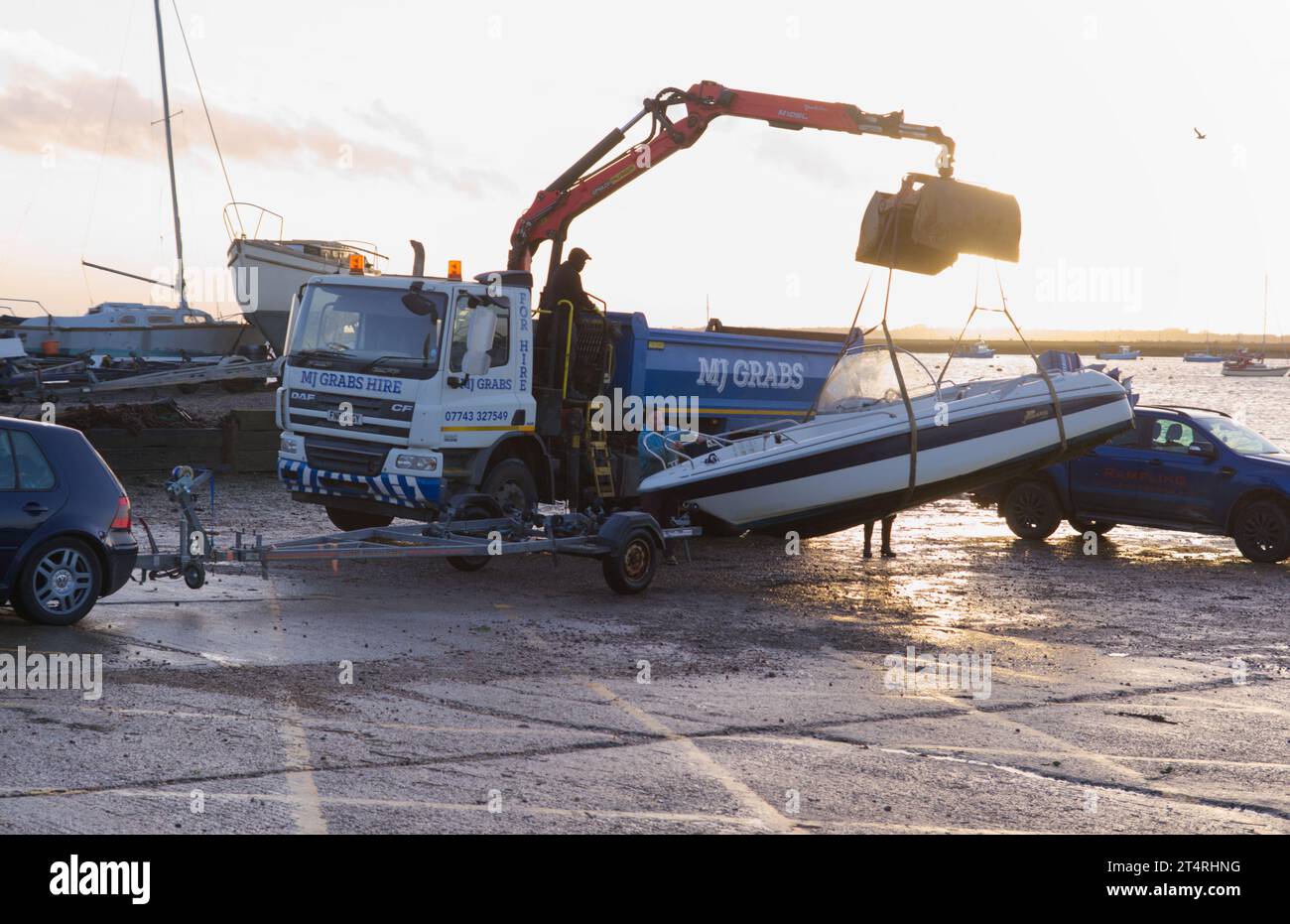 West Mersea, UK. 1st Nov 2023. A boat is being moved away from the