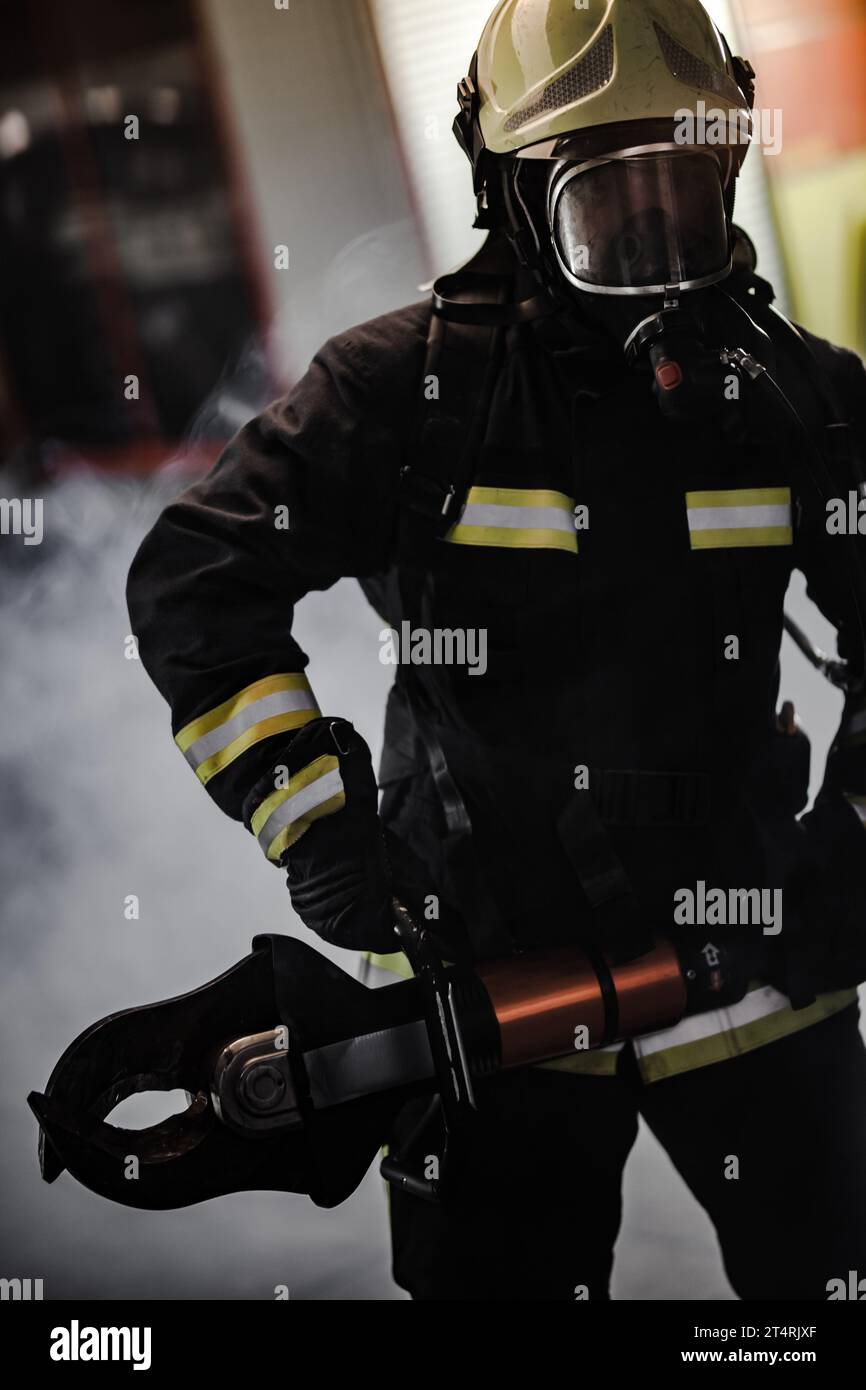 Fireman Power Fireman portrait wearing full equipment with oxygen mask and power ...