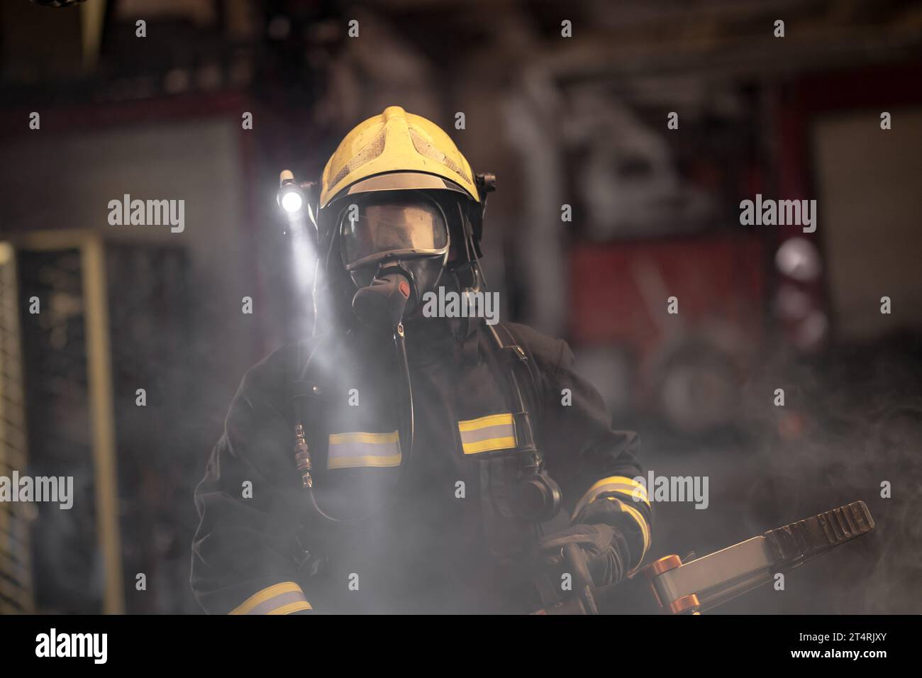 Fireman Power Fireman portrait wearing full equipment and oxygen mask. Firefighter ...