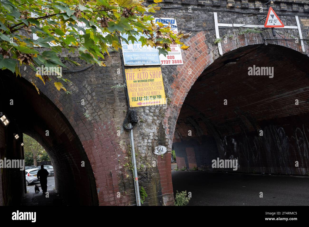 Ads for local businesses are displayed on a railway bridge in Loughborough Junction, on 1st November 2023, in London, England. Loughborough Junction in the south London borough of Lambeth is soon to undergo extensive change and redevelopment as nearby high-rises and flat complexes attracts a younger local Stock Photo