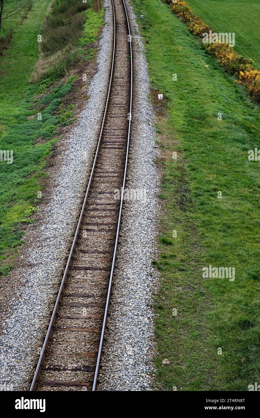 Railway bed. Fragment of railway tracks, top view, rails and sleepers. Stock Photo