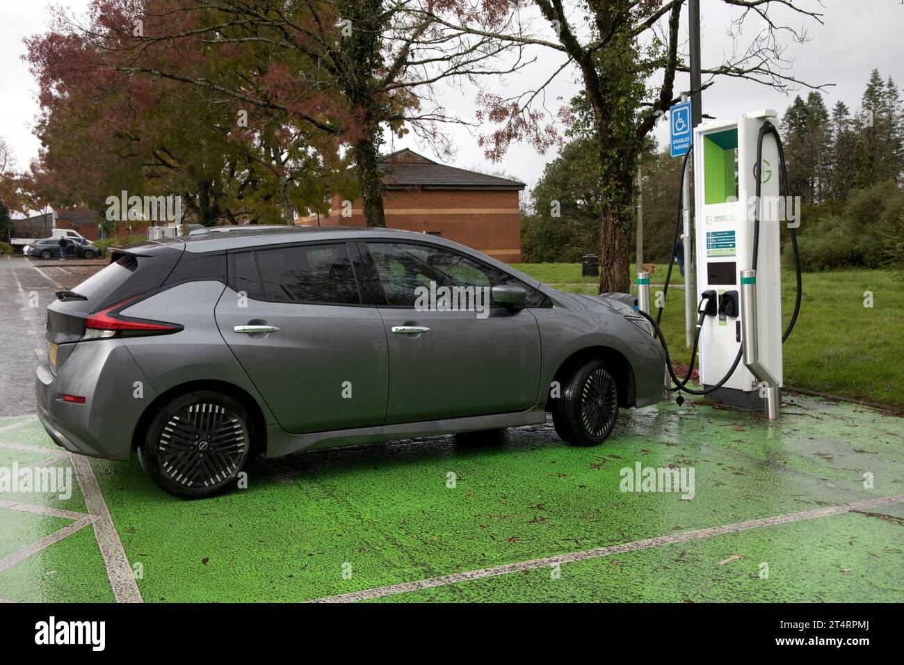 Nissan Lead  electric car charging at banbk of chargers in rest area of Junction 47 on the M4 part of Gridserve Electric Highway Network UK Stock Photo