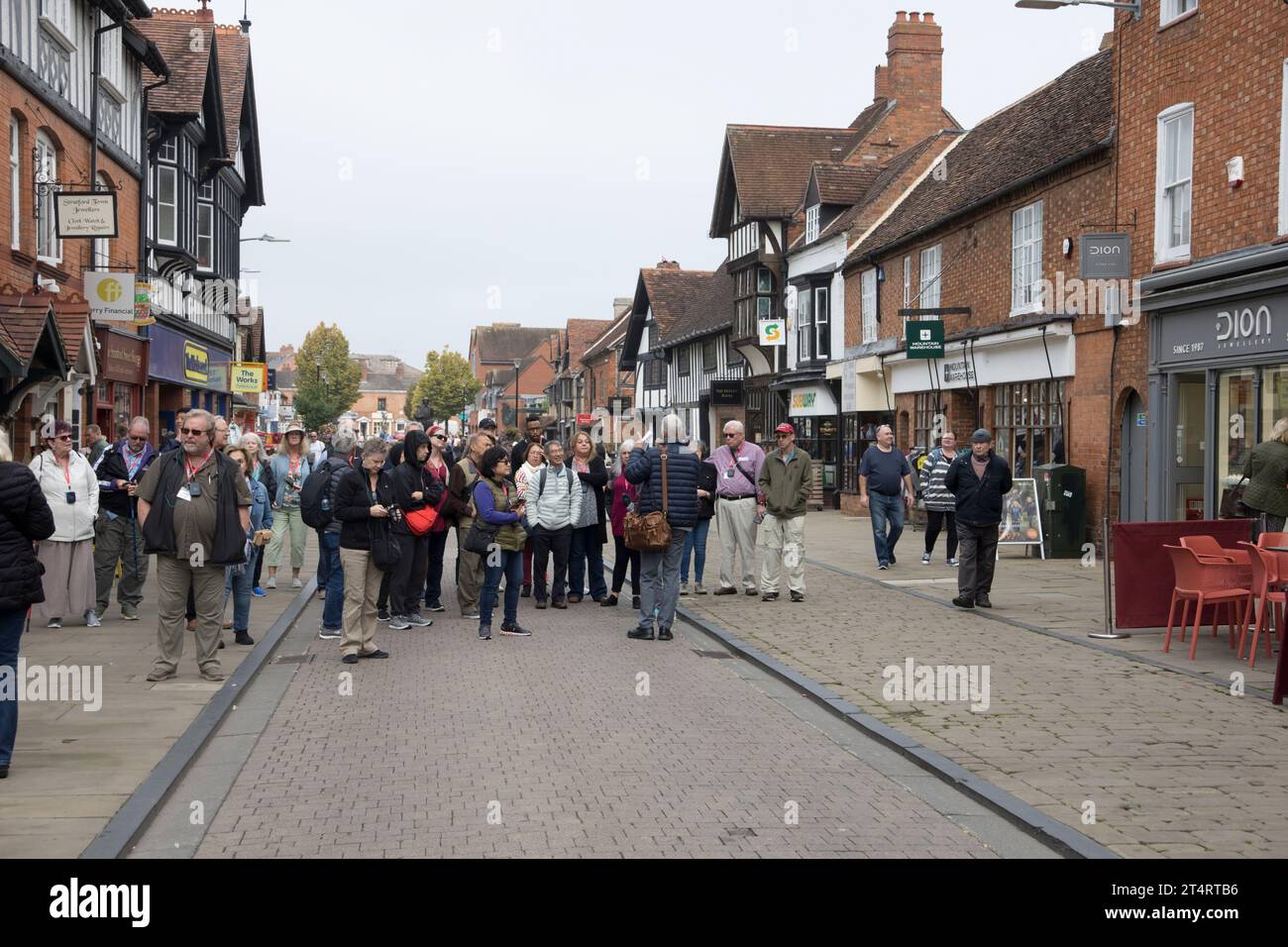 Tour group with tour guide in Henley Street near Shakespeare's birthplace  Stratford on Avon UK Stock Photo