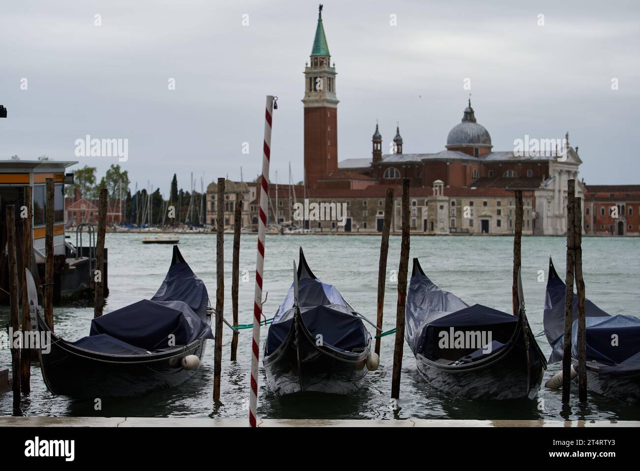 Gondola boats in Grand Canal with San Giorgio Maggiore (San Zorzi Mazor in Venetian) church on the background. Venice - 5 May, 2019 Stock Photo