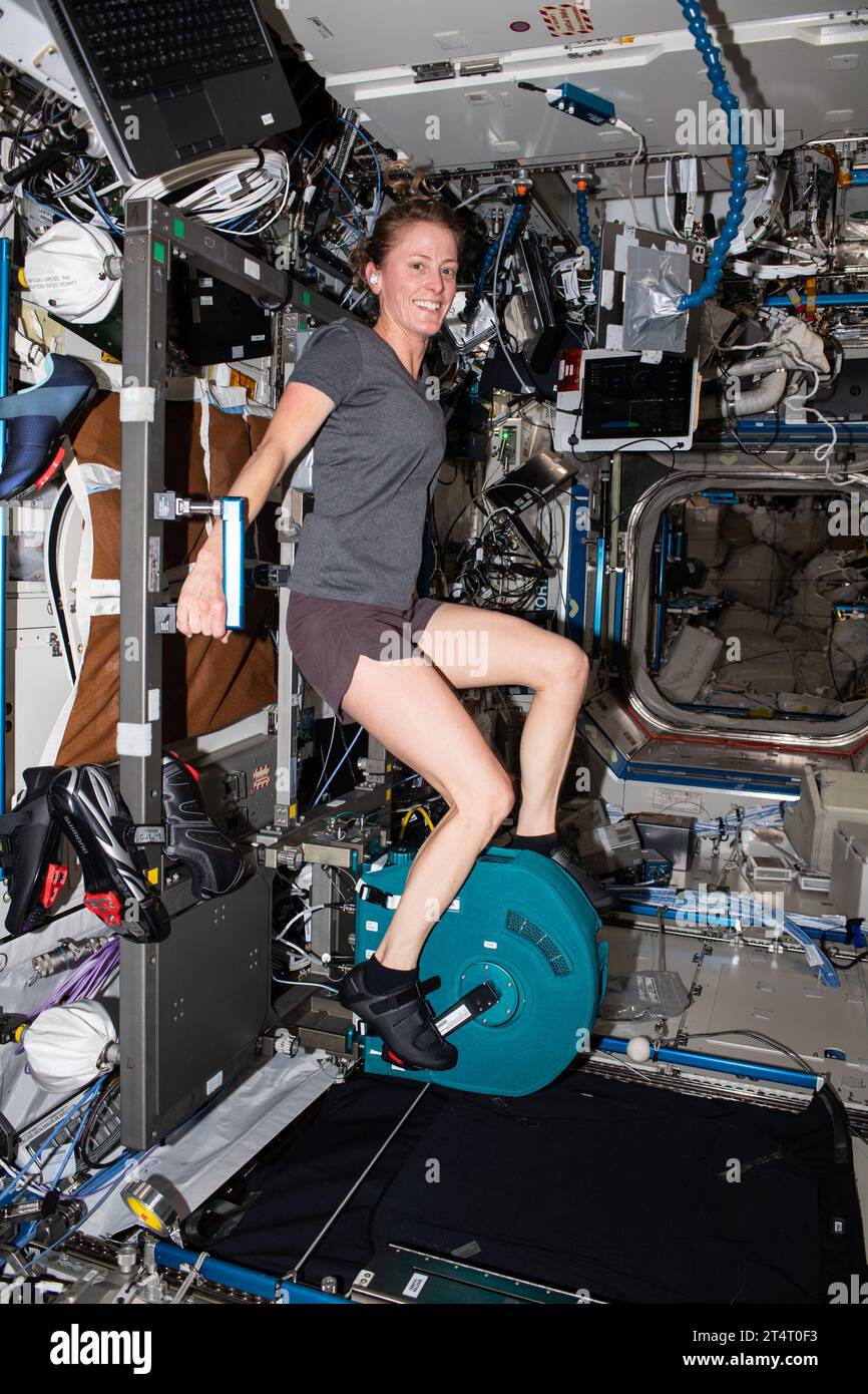 International Space Station, Earth Orbit. 25 October, 2023. NASA astronaut and Expedition 70 Flight Engineer Loral O'Hara pedals on an exercise cycle, also known as CEVIS, or Cycle Ergometer Vibration Isolation System, inside the Destiny laboratory module aboard the International Space Station, October 25, 2023 in Earth Orbit.  Credit: ISS Crew/NASA/Alamy Live News Stock Photo