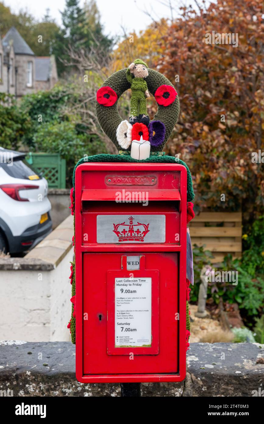Nairn, Highlands and Islands, UK. 1st Nov, 2023. This is a knitted Woolen Lest We Forget Emblem on a Post Box in Nairn Town Centre. Credit: JASPERIMAGE/Alamy Live News Stock Photo