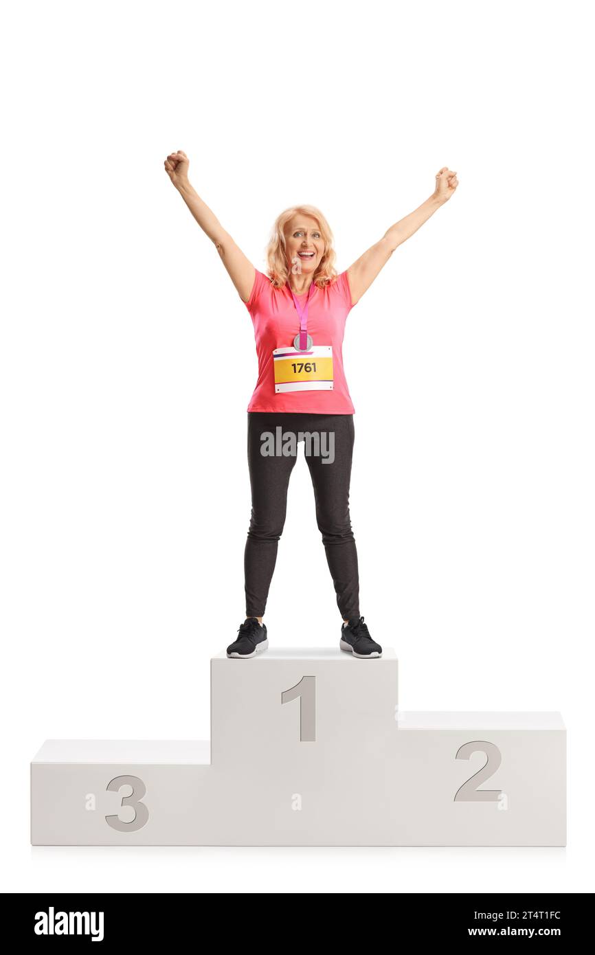 Full length portrait of a female marathon winner standing on a podium isolated on white background Stock Photo