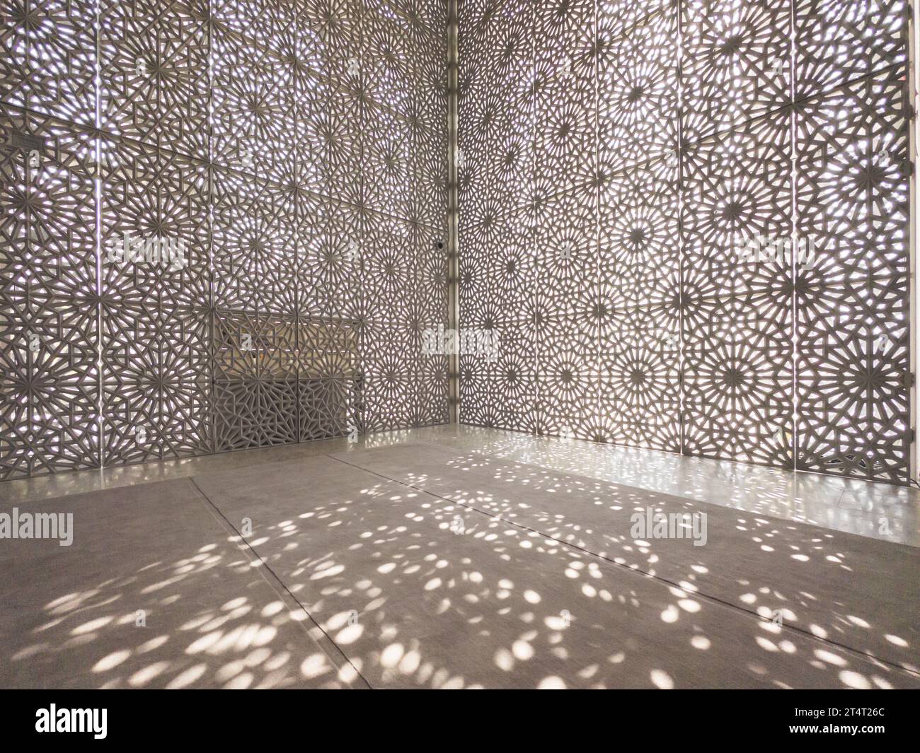 Shadows of the mashrabiya patterned interior of The Ahmed El-Tayeb Mosque at the The Abrahamic Family House in the Saadiyat Island Cultural District Stock Photo