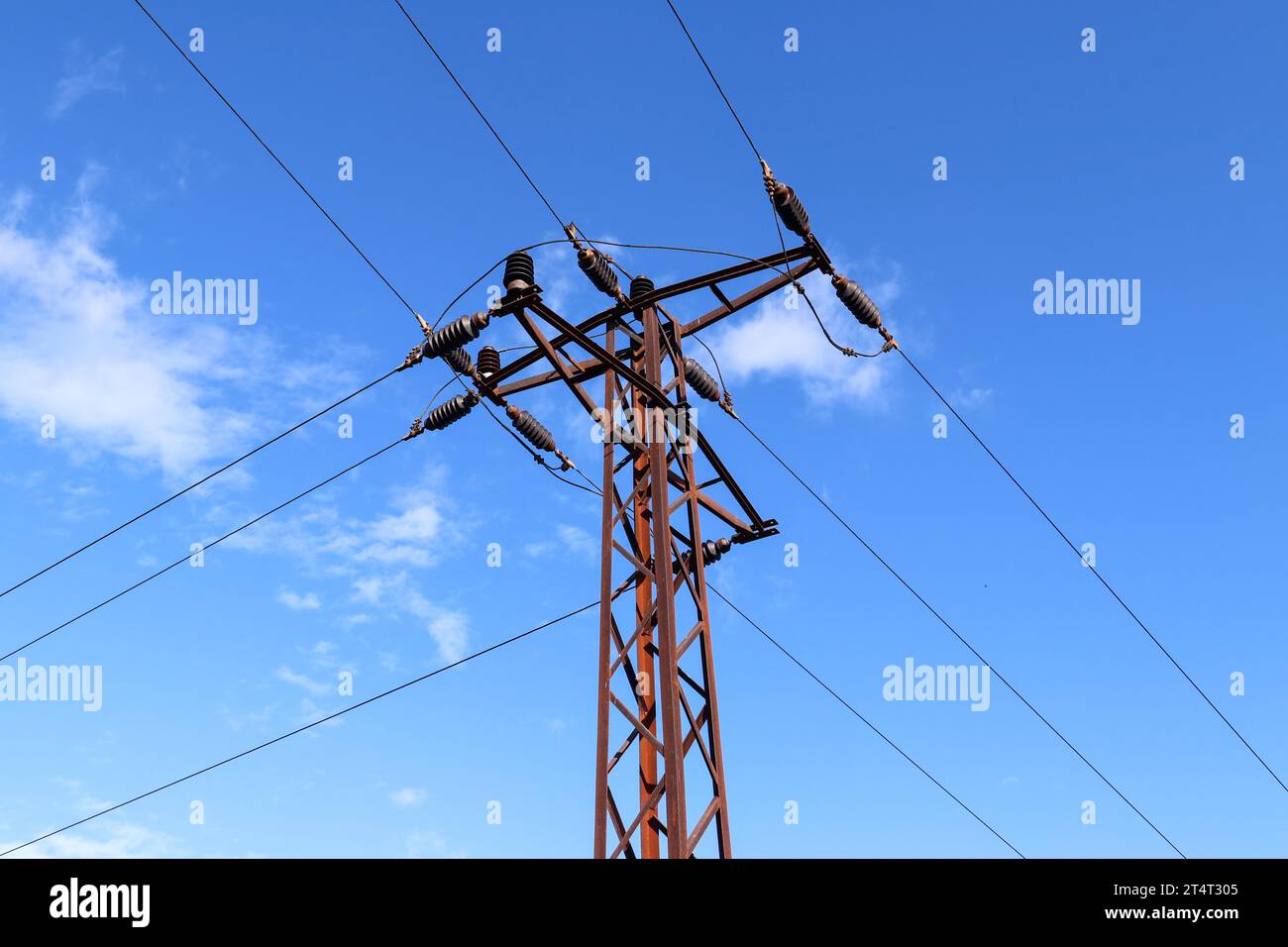 Distribution of electrical energy - high voltage line pole Stock Photo