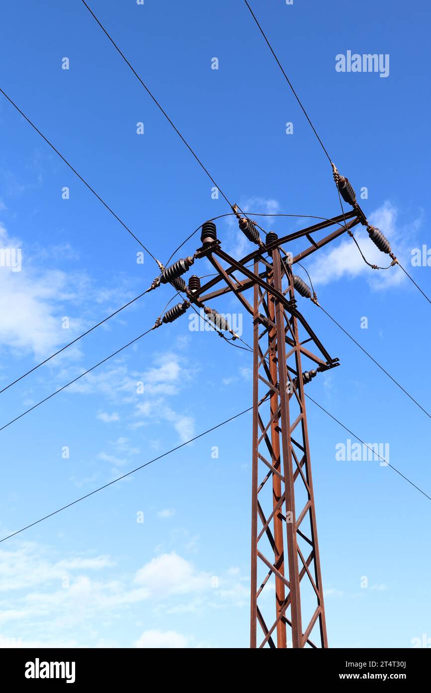 Distribution of electrical energy - high voltage line pole Stock Photo