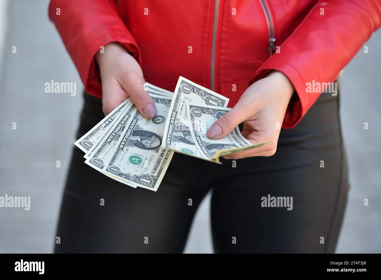 Counting money on street woman hi-res stock photography and images - Alamy