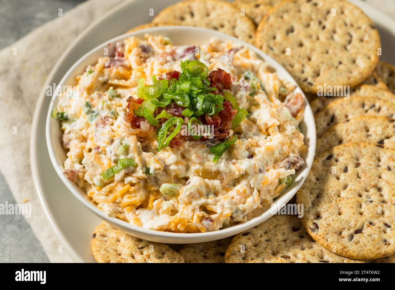 Homemade Million Dollar Cheese Dip with Bacon and Crackers Stock Photo