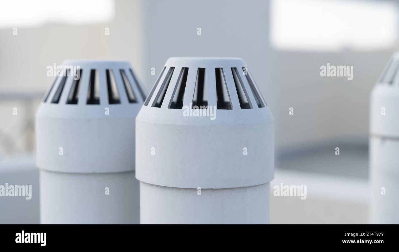multiple toilet ventilation pipe on top of the apartment Stock Photo