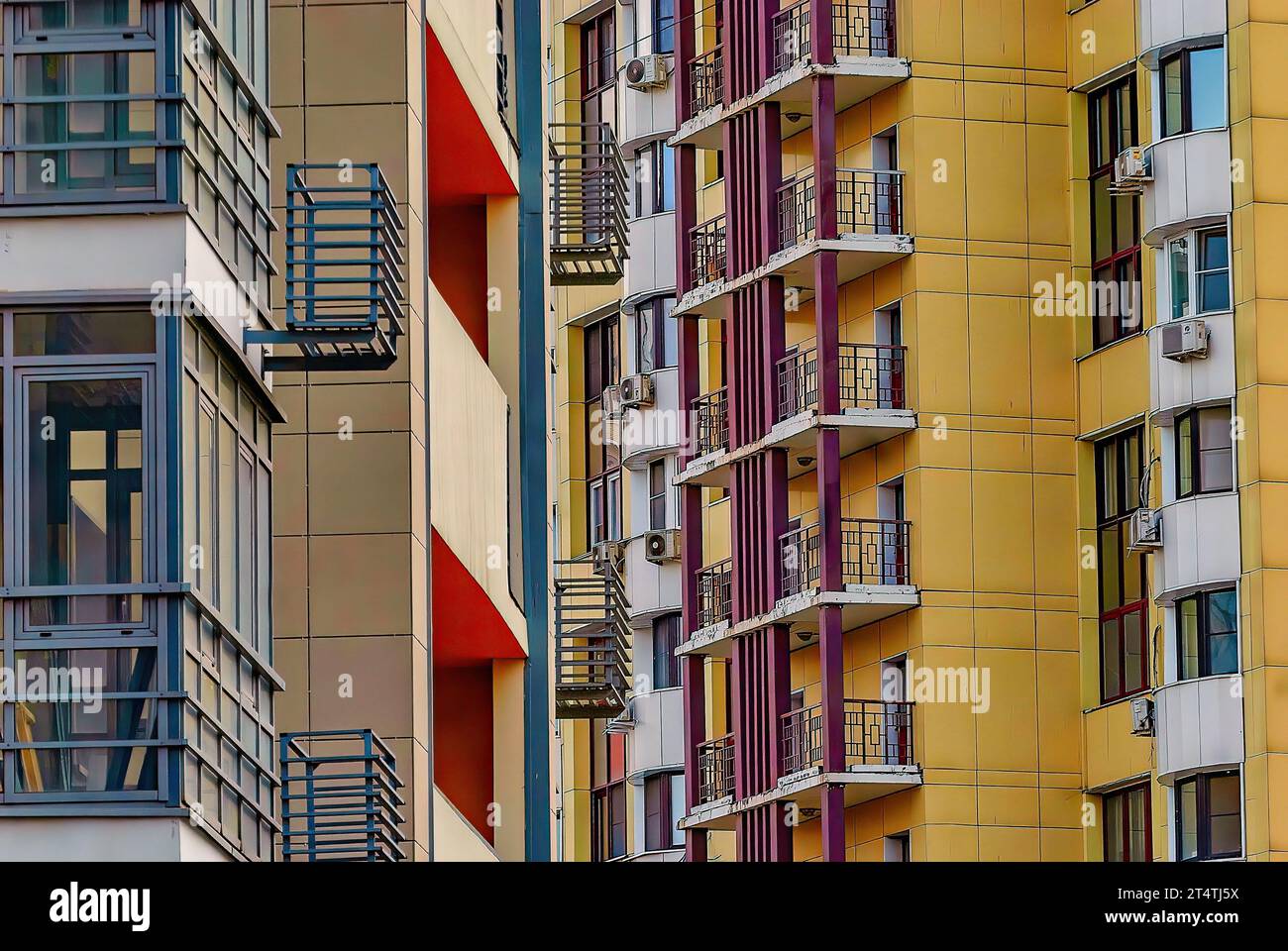 facade of a modern apartment building with balconies and colorful ...