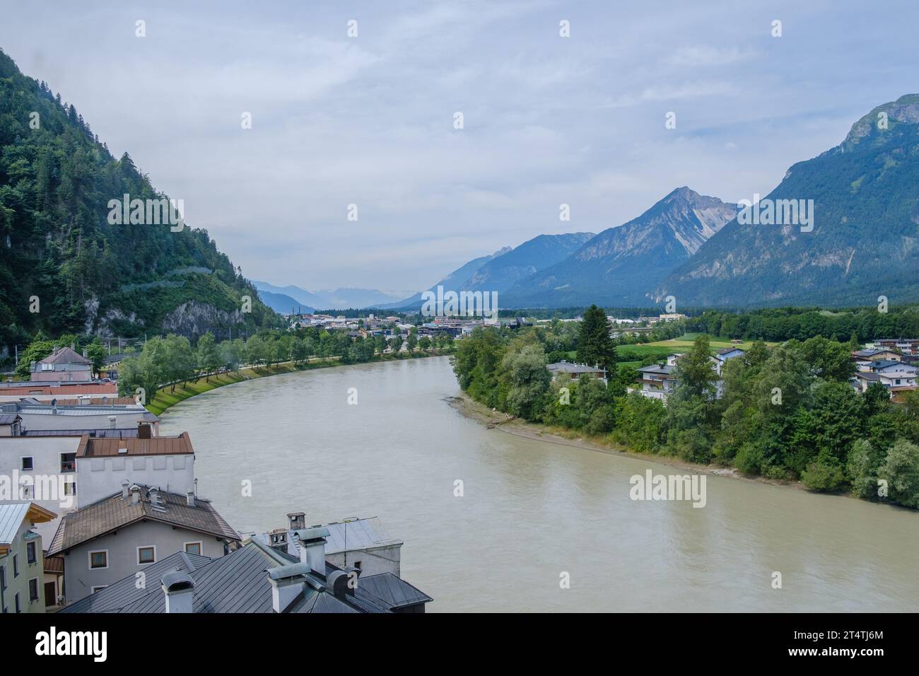 Elevated view from church tower viewing platform inside Augustinermuseum of the Inn River & towns of Rattenberg & Kramsach with mountains. Austria. Stock Photo