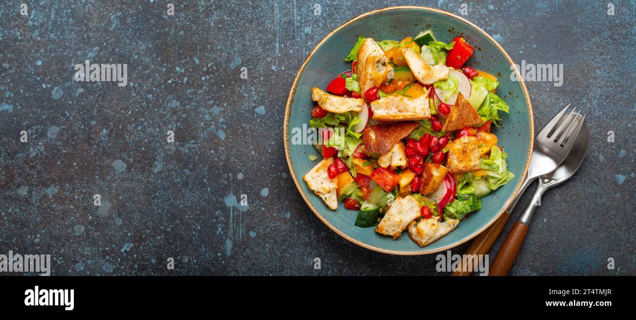 Traditional Levant dish Fattoush salad, Arab cuisine, made with pita bread croutons, vegetables