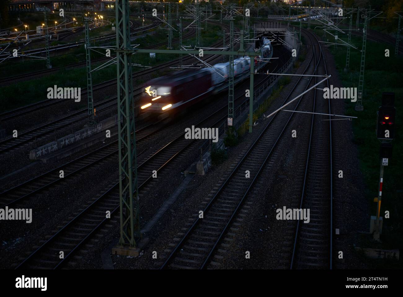 A freight train passes through northern Berlin, Germany 2022, in the evening. Stock Photo