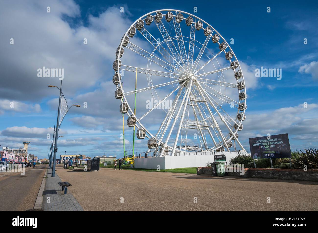 The image is of the typical English seaside holiday resort town of Great Yarmouth looking along the promenade with its various tourist attractions Stock Photo