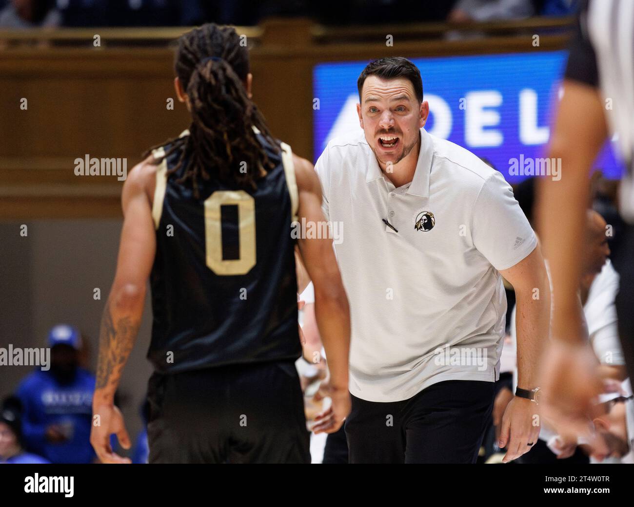 UNC Pembroke head coach Drew Richards, right, talks to UNC Pembroke's