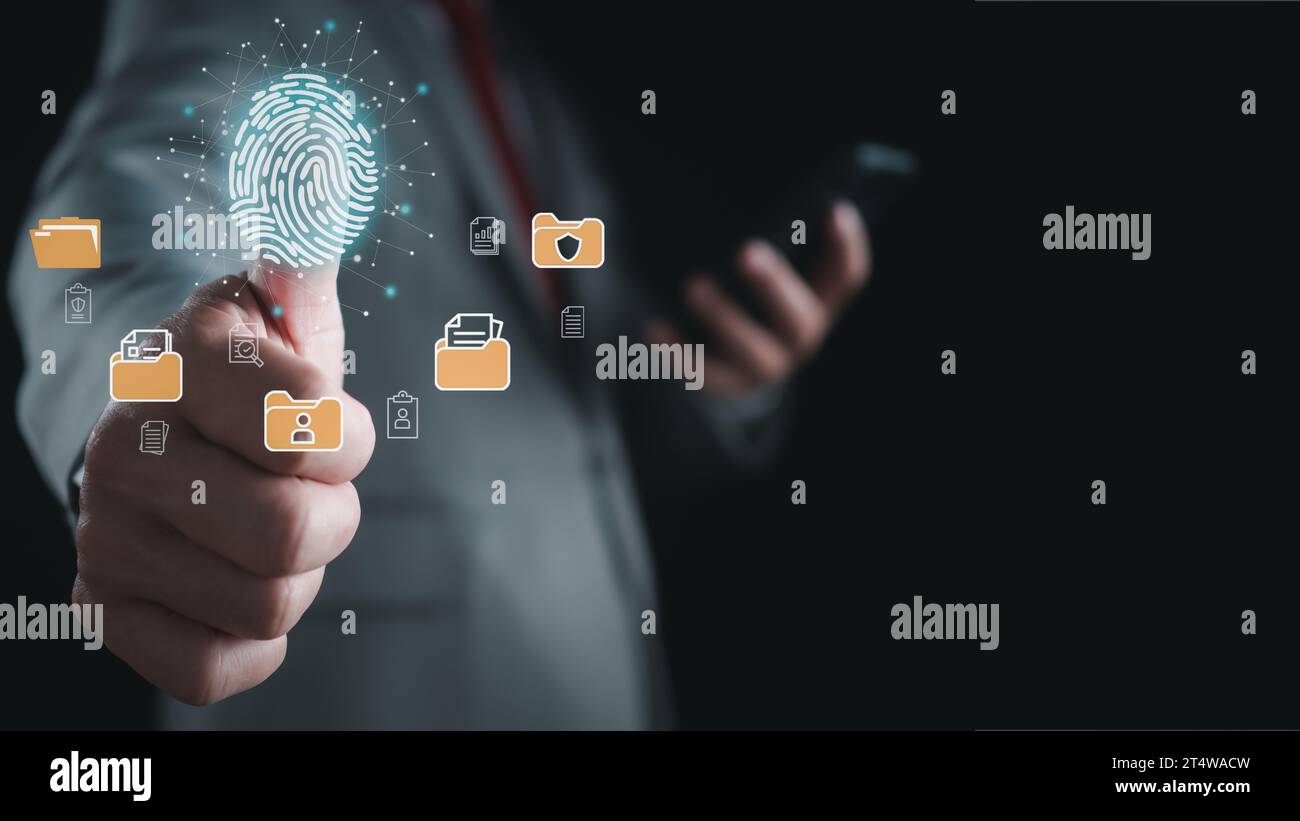 Businessman using fingerprint scanner to log in showing cyber security protection and data security concept including secure login Stock Photo