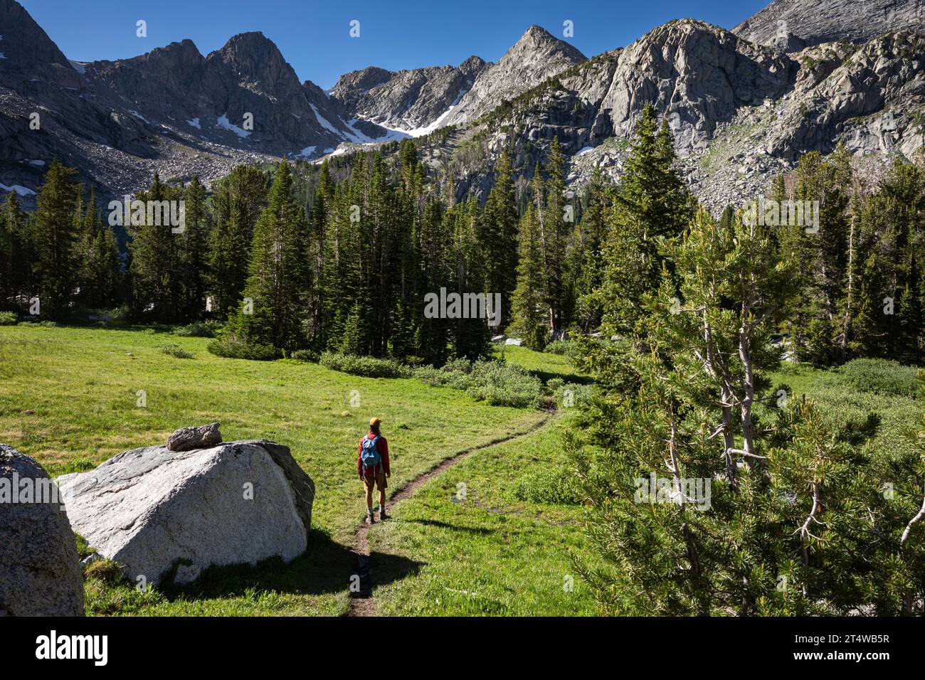 WY05555-00...WYOMING - Hiker on the Lonesome Lake Trail in the Cirque of the Towers, Popo Agie Wilderness area of the Wind River Range. Stock Photo
