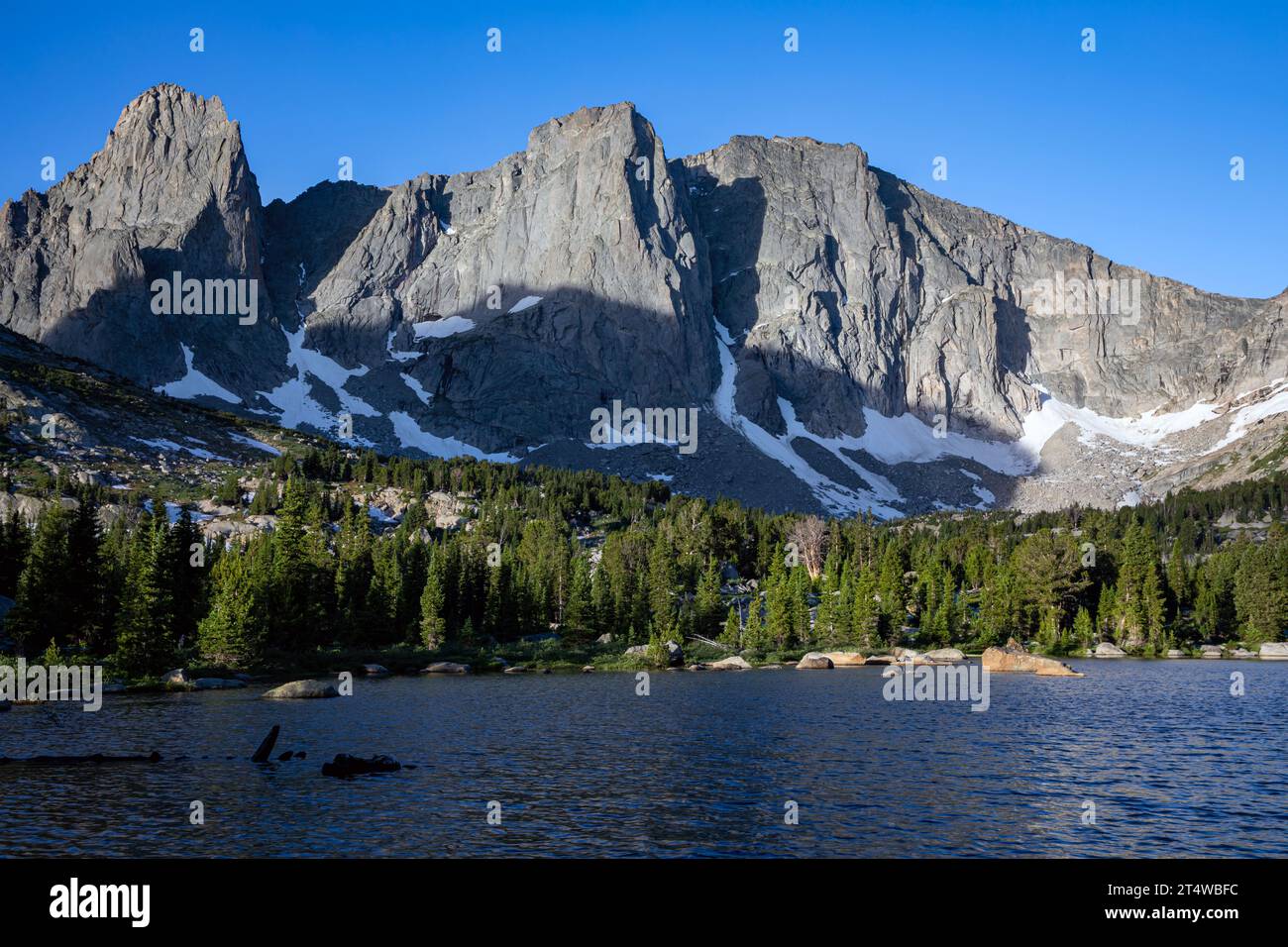 WY05561-00...WYOMING - - Warbonnet, Warrior and Warrior 2 Peaks above Lonesome Lake in the Cirque of the Towers in the Popo Agie Wilderness. Stock Photo