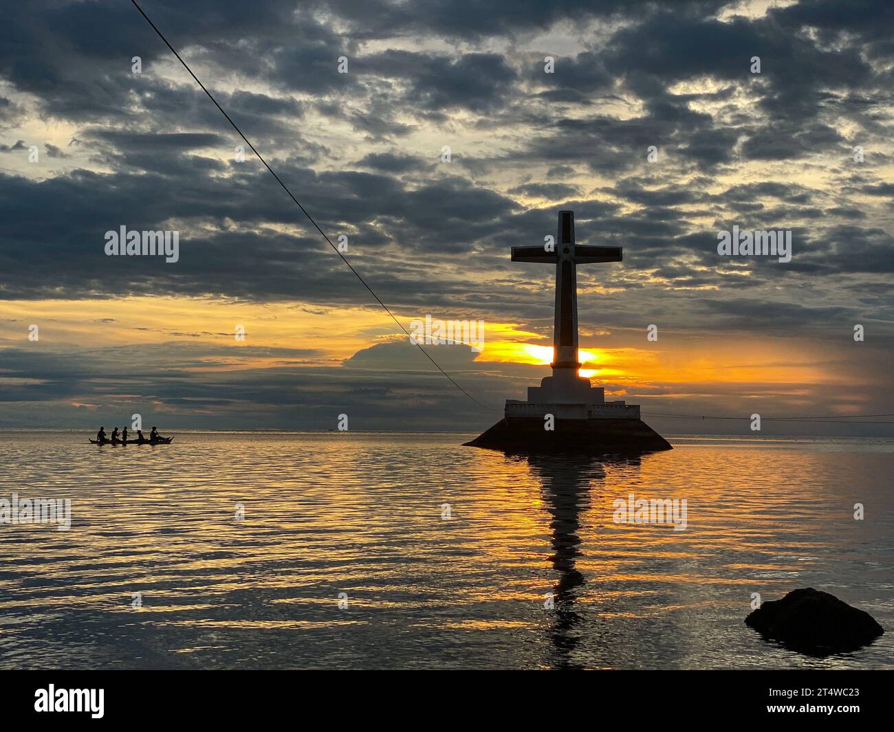 Boat going to Sunken Cemetery in Camiguin Island. Philippines. Twilight over the sea. Stock Photo