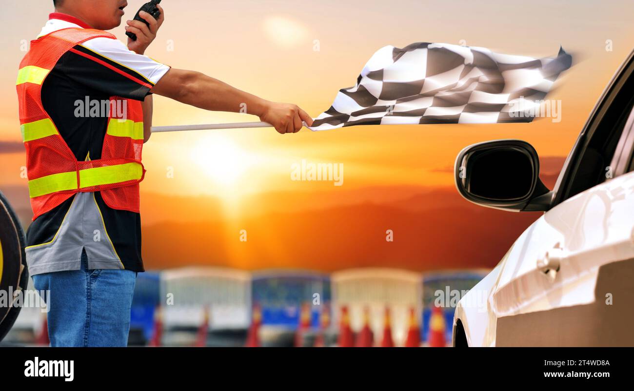 Checkered race flag in hand stock photo alamy