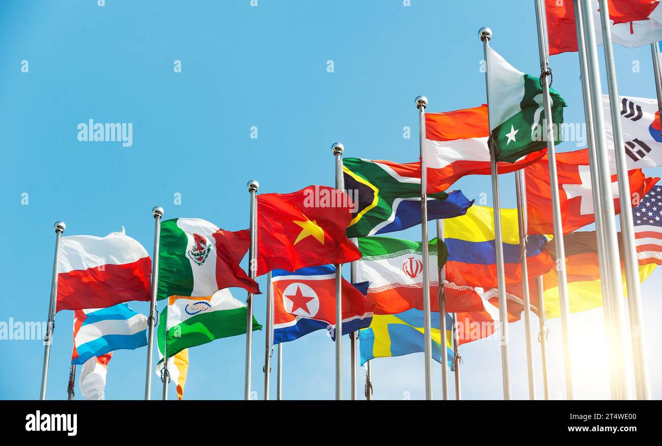 Set of flags fluttering in the wind against blue sky background Stock ...