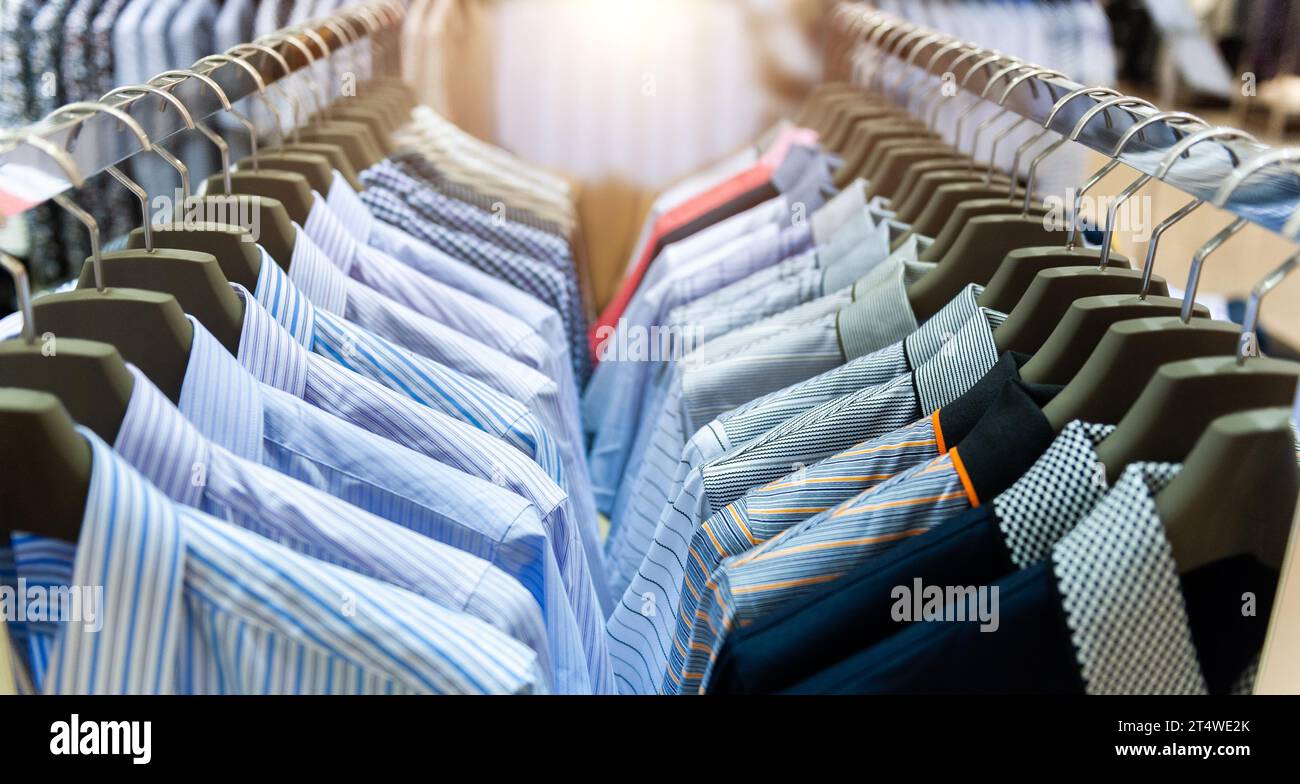 Row of hanger with shirts in a store Stock Photo