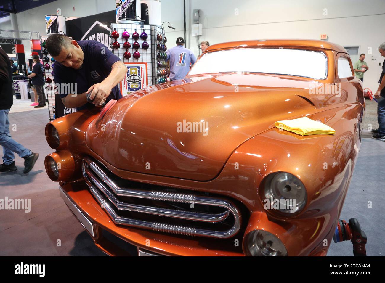 Las Vegas, United States. 01st Nov, 2023. An exhibitor is seen power waxing the Solar Scene II, a custom Mercury car built by legendary car builder Gene Winfield, on display during the 2023 SEMA Show, at the Las Vegas Convention center in Las Vegas, Nevada, Wednesday, November 1, 2023. This fully custom Mercury is fashioned after the original Gene Winfield Solar Scene built in 1963. Photo by James Atoa/UPI Credit: UPI/Alamy Live News Stock Photo