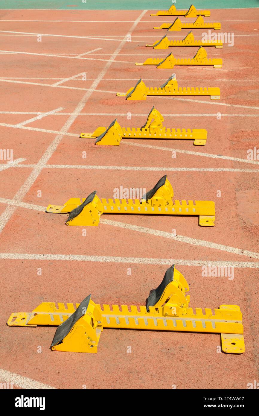 Starting blocks in the plastic on the playground Stock Photo - Alamy